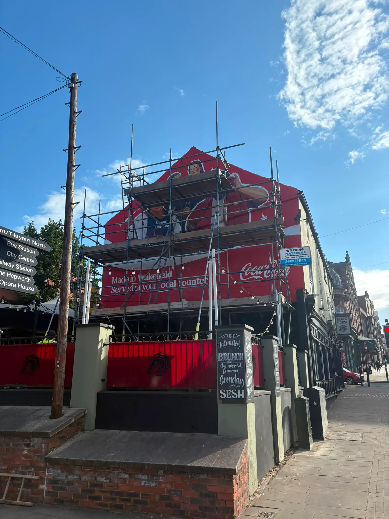 Multi-level scaffolding for wall murals providing full access for the Coca-Cola artwork completion in Yorkshire.