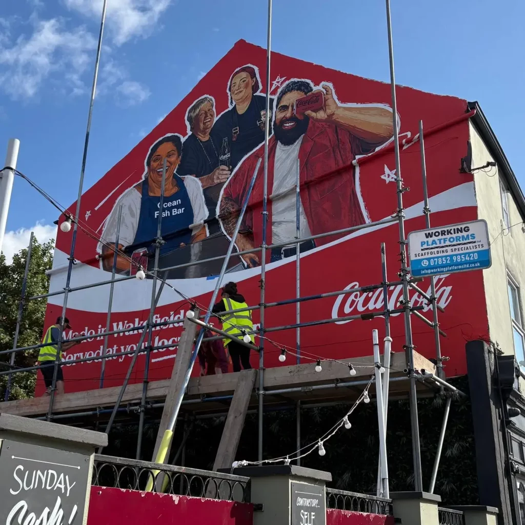 Mural Republic at Work for Coca-Cola on the Black Horse Pub in Wakefield